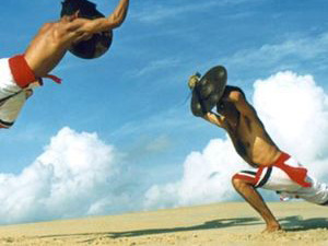 Kalarippayattu martial artists demonstrating with weapons