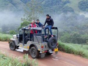 Open jeep on a forest track during a Thekkady jeep safari